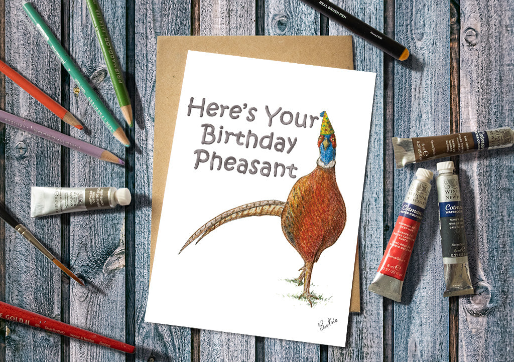 A humorous birthday card with the words, here's your birthday pheasant & an illustration of a pheasant wearing a birthday hat.