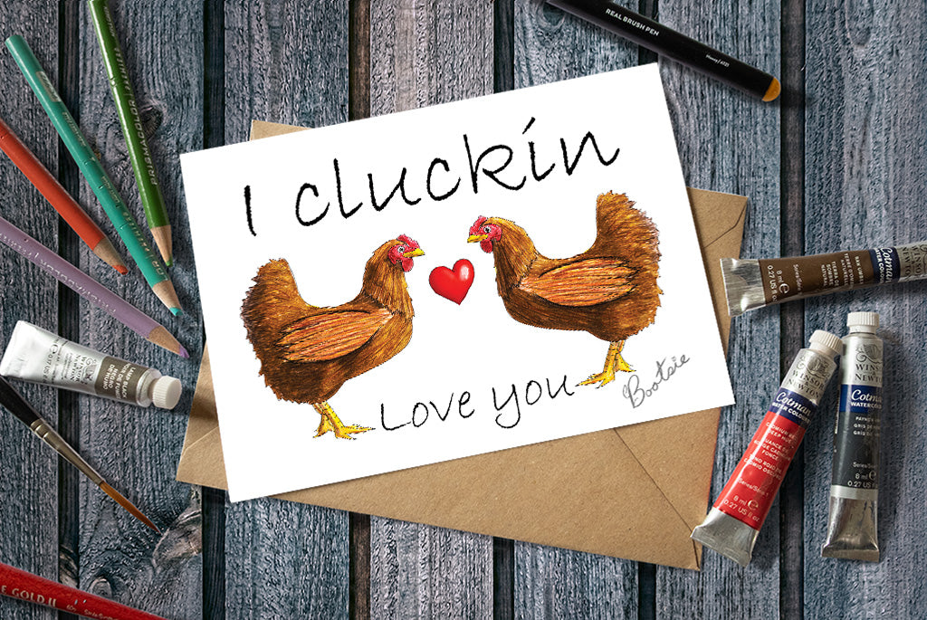 Greetings card with two chickens and text I cluckin love you.
