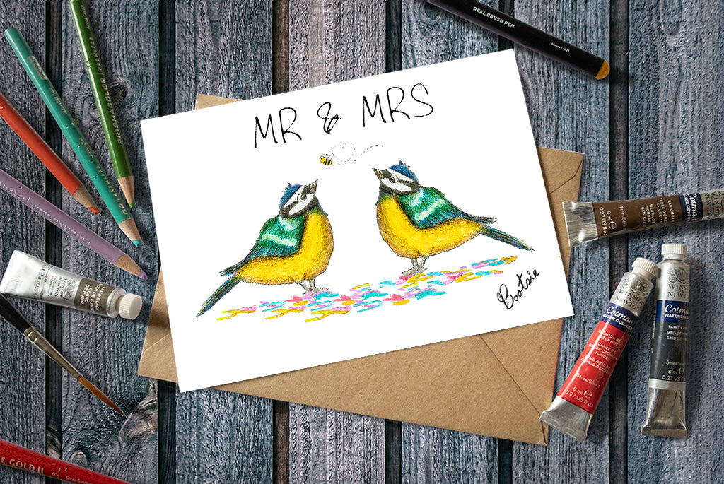 A Mr & Mrs Greetings Card, an illustration of 2 Blue Tits Watching A Bee whilst Stood on confetti
