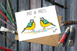 A Mr & Mrs Greetings Card, an illustration of 2 Blue Tits Watching A Bee whilst Stood on confetti