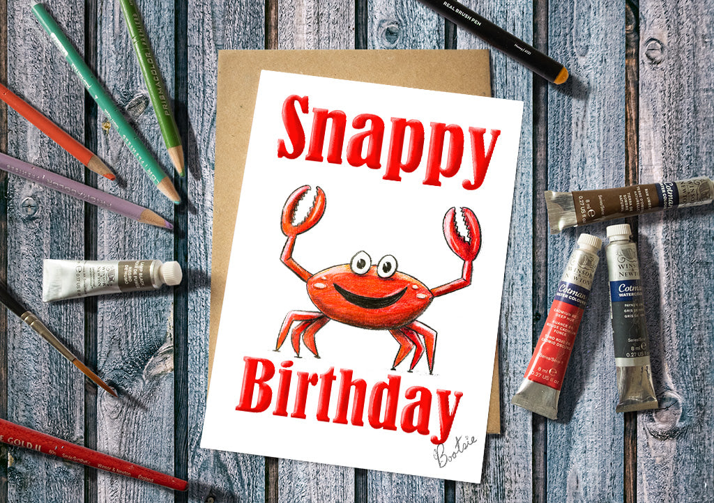 Birthday card with a red crab illustration and 'Snappy Birthday' text.